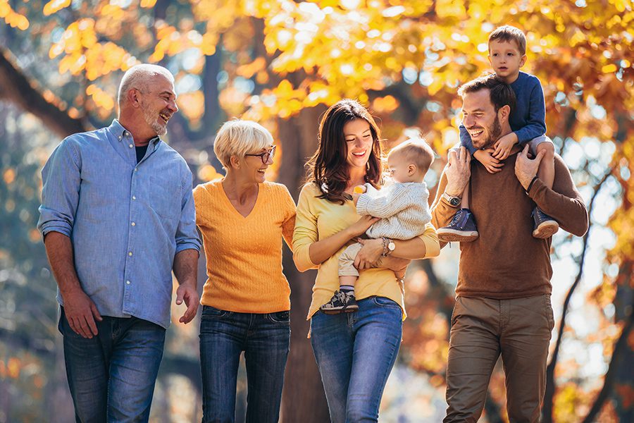 Personal Insurance - Multigenerational Family in Autumn Park Having Fun